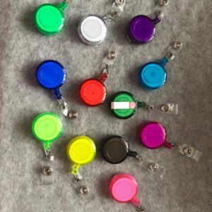 Retractable clips, green, white, purple, light blue, blue, red, pink, yellow, black