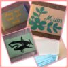 Face mask box, oblong, storage, green, white, wording, flower, shark